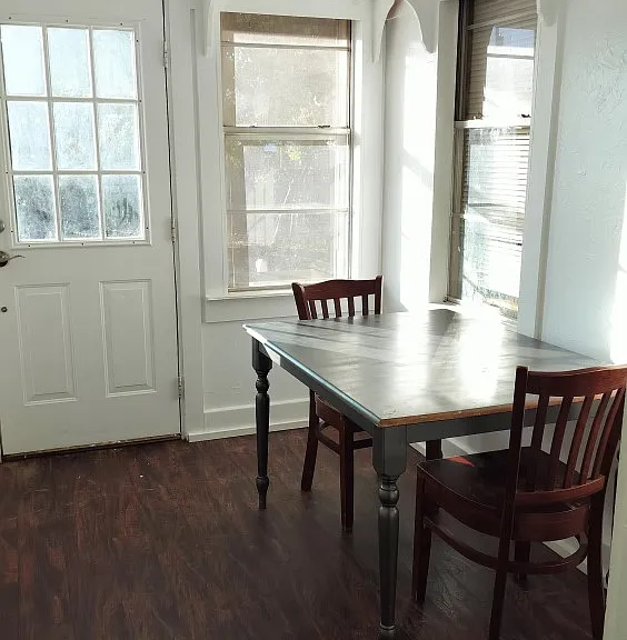 An eating area by the back door. Each individual room also has a desk and chair.