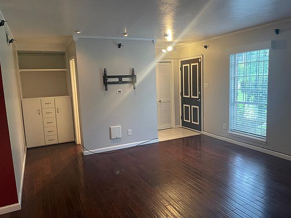 front door, living room, storage, 1/2 bath to right