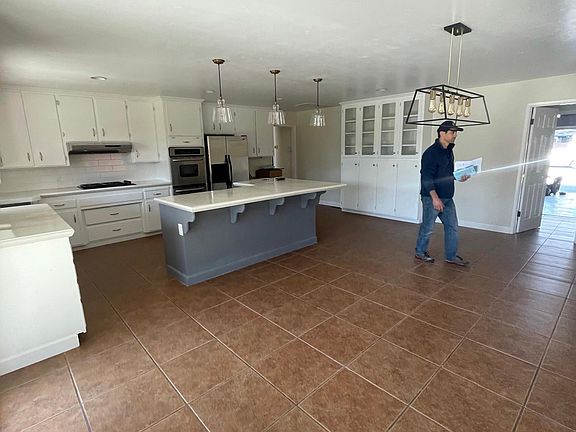 Large spacious kitchen with plenty of natural light and storage.