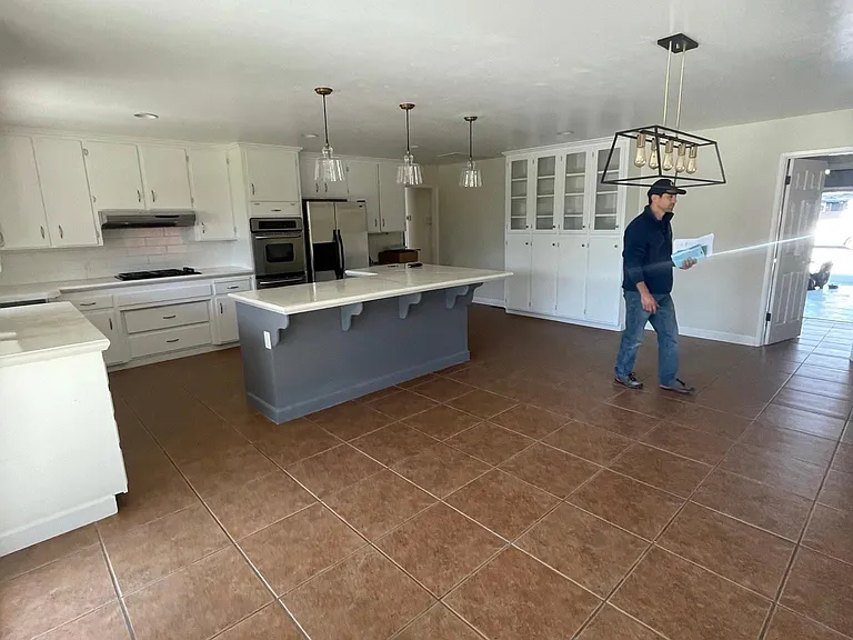 Large spacious kitchen with plenty of natural light and storage.