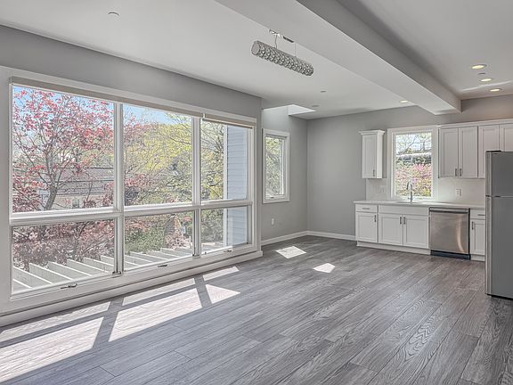 Living room/ Dining Room/ Kitchen open floor plan with views of Saugatuck River