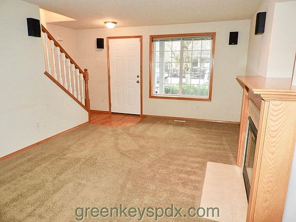 Living room with view of stairs leading up