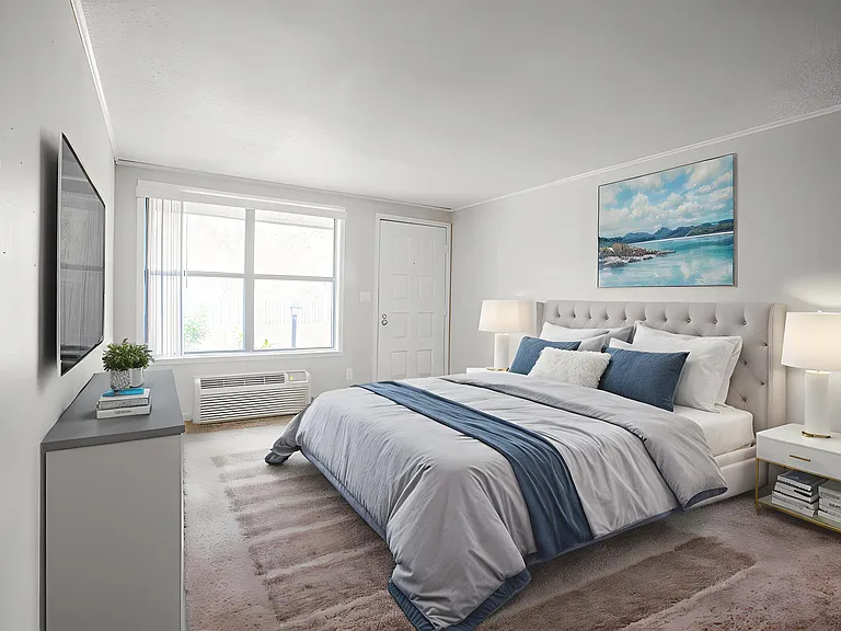 Bright and inviting bedroom with elegant decor, featuring a plush bed, stylish bedside tables, and large window allowing natural light to flood the space.