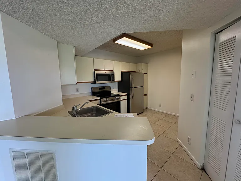 8891 Wiles Rd #303 — Photo 7
