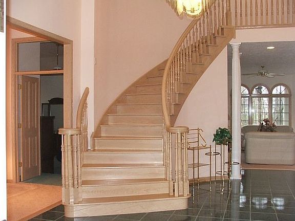 2 Story foyer entrance with tile flooring