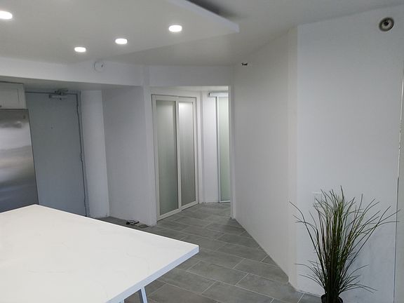 Hallway to rooms and bathroom