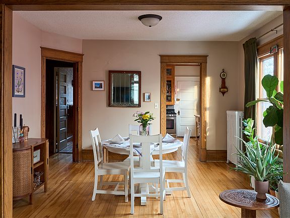 Bright dining room leads to the two bedrooms, bath, and kitchen.