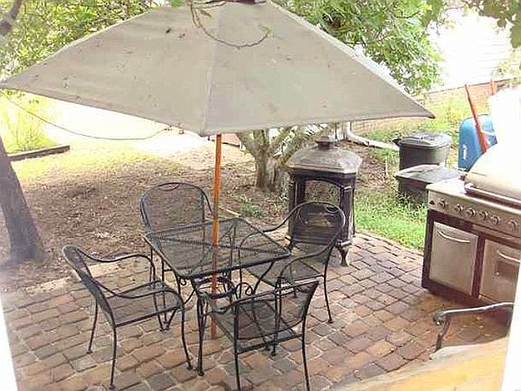 Patio beside screened porch