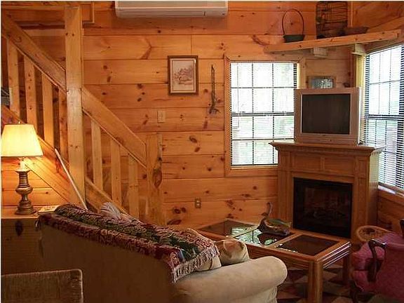 Small cabin electric fireplace and TV room.