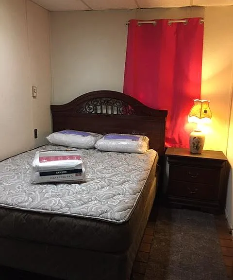 QUEEN SIZE BED WITH BIG BEAUTIFUL MATTRESS AND BOX SPRING, NEW MATRESS PAD AND PILOWS. YOU HAVE TO SUPPLY YOUR OWN LINENS AND TOWELS..