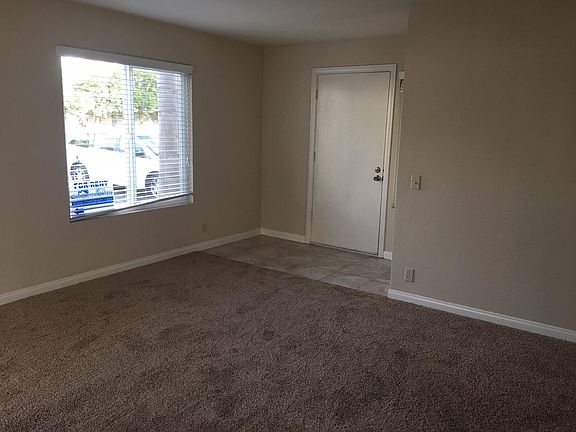 View of front door from living room