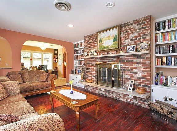 COZY UP TO THE FIREPLACE IN THE FRONT LIVING ROOM.