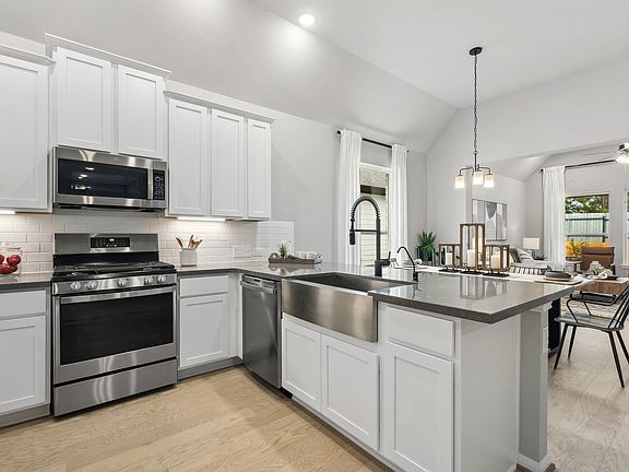 Kitchen with stainless steel apron-front sink