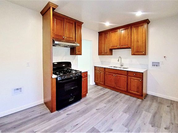 Kitchen with laundry hook-ups