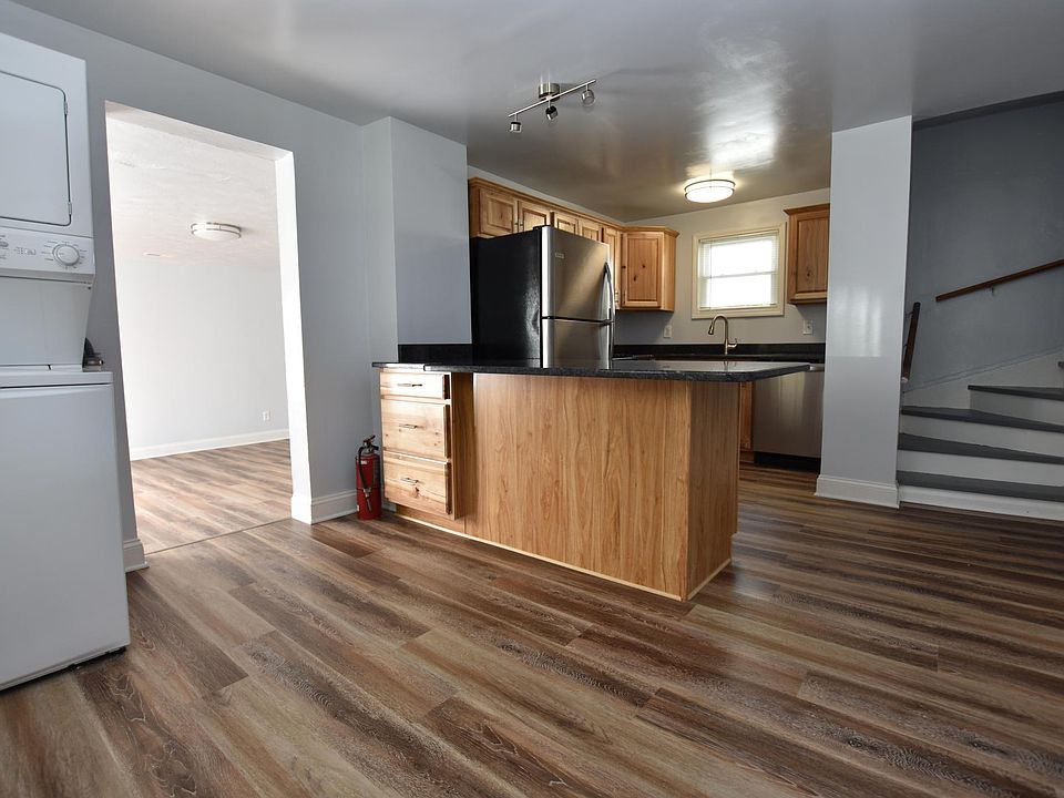 Laundry and kitchen, room for 4 at the island as well as a small kitchen table.