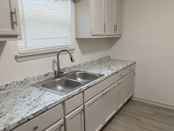 Bright kitchen with granite - style countertops, plenty of cabinet storage, and updated finishes throughout.