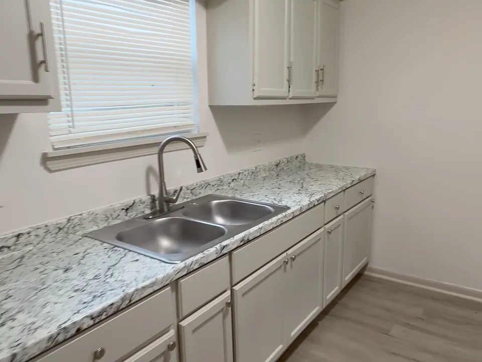 Bright kitchen with granite - style countertops, plenty of cabinet storage, and updated finishes throughout.