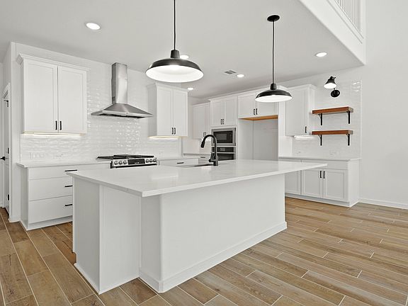 Kitchen with island and pendant lighting