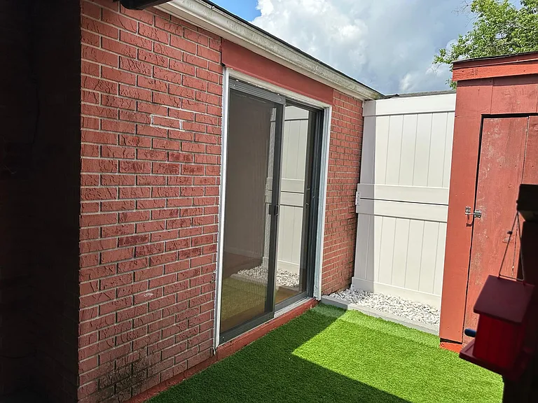 SLIDING DOOR FROM MASTER BEDROOM EXTERIOR AREA.