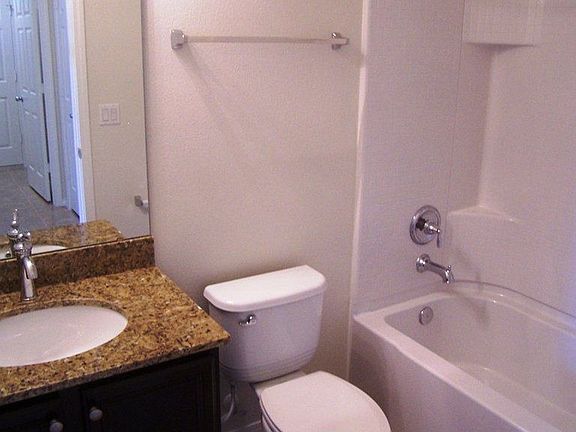 Secondary bath with granite tops and dolce cabinets