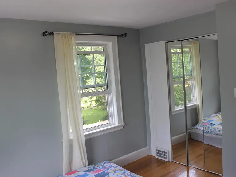 Bedroom 1- Guest bedroom with 2 windows and big size closet with mirror doors.