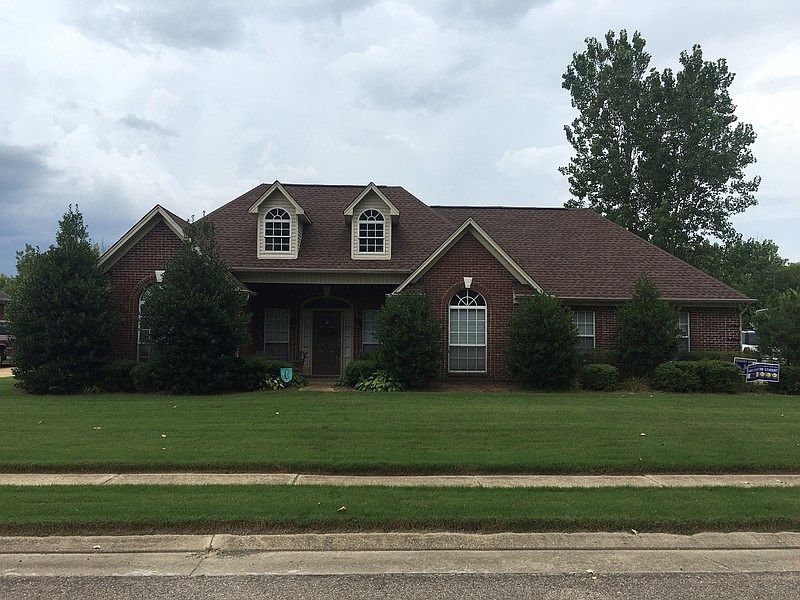 House - Front
						:
						View of the front of the house from the street.