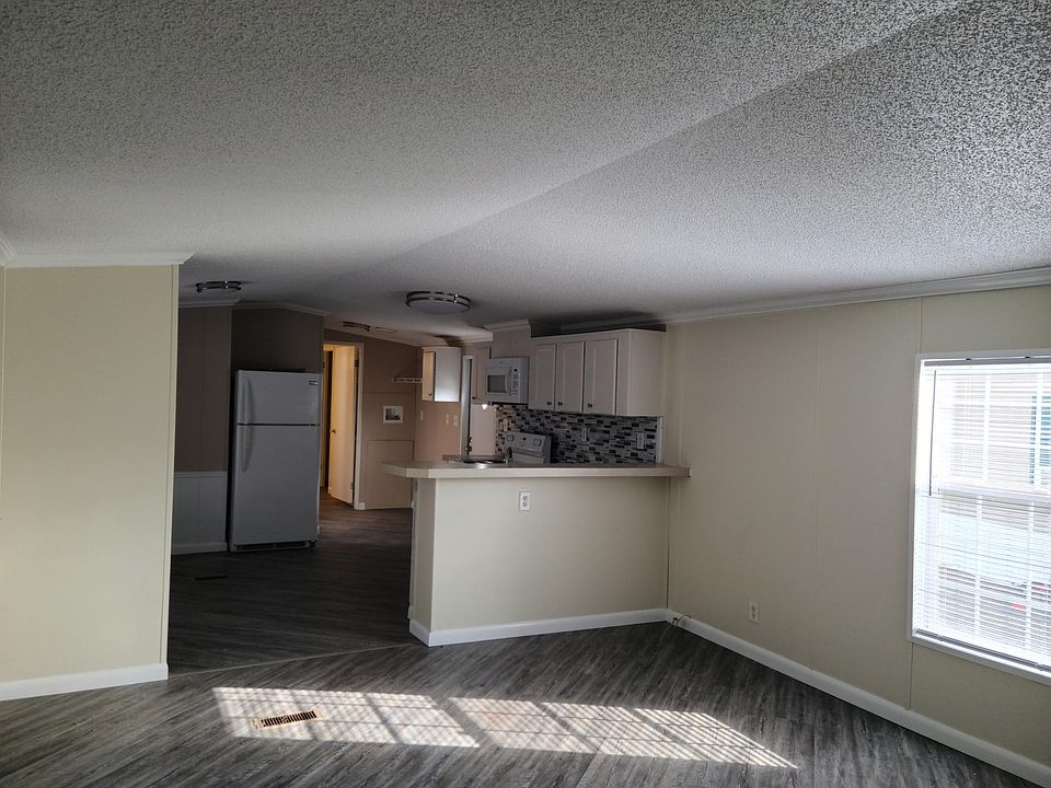 Living room looking back into kitchen