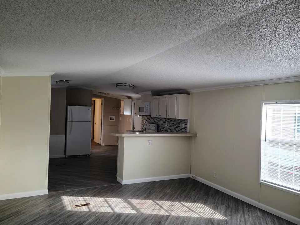 Living room looking back into kitchen