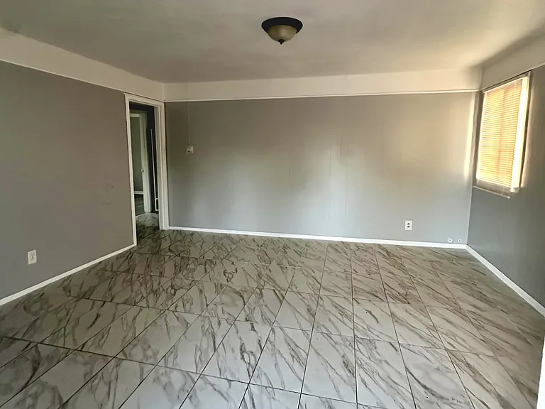 Living room view looking inside from entrance door.