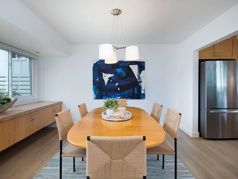 Dining area with new chairs, area rug and new hardwood flooring!