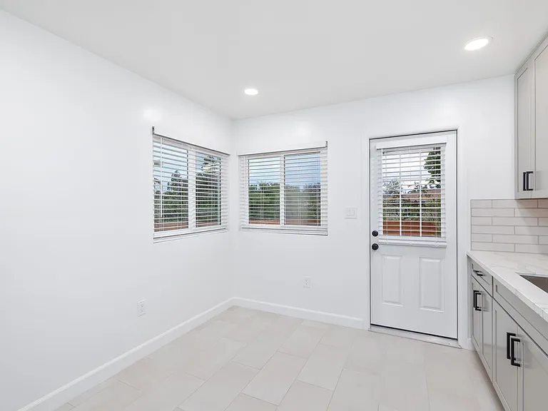 Flexible bonus area for dining or storage, featuring direct backyard access.