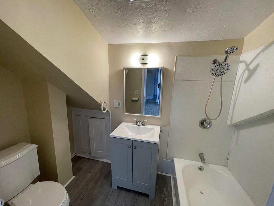 Full bathroom with shower and tub