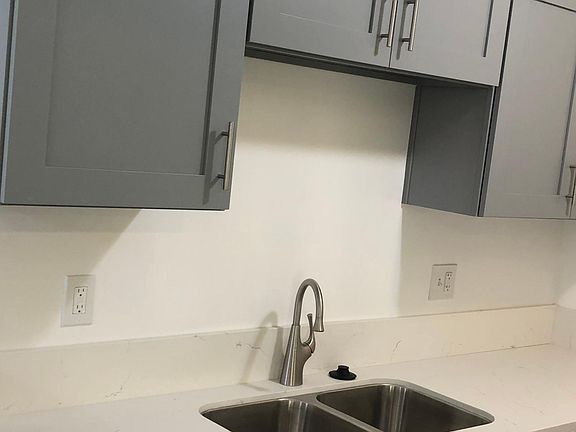 New cabinets, sink, and faucet.