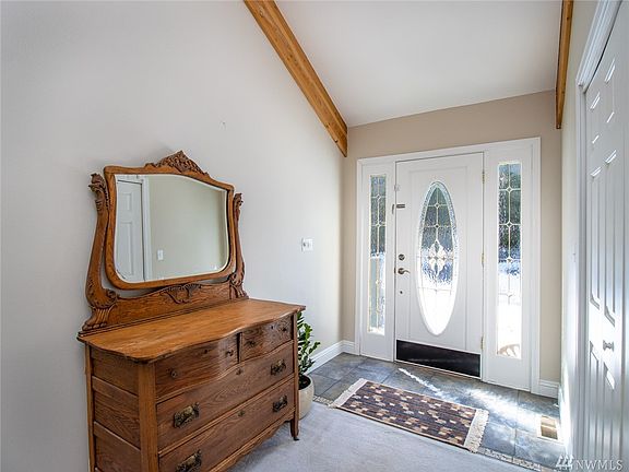 Lovely formal entry is located in the back of the home. Nice tiled floors & a coat closet for guests.