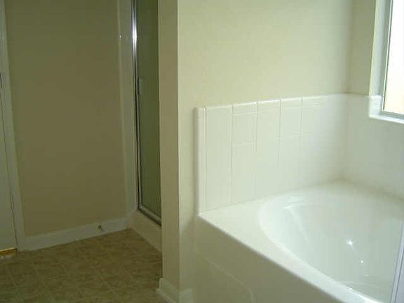 Master bedroom downstairs and master bath room with garden t