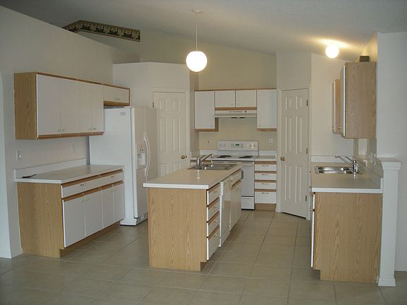 Kitchen.  Note additional sink & pantry cabinets.
