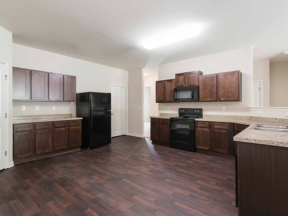 Gorgeous upper-wood cabinets in the heart of the home