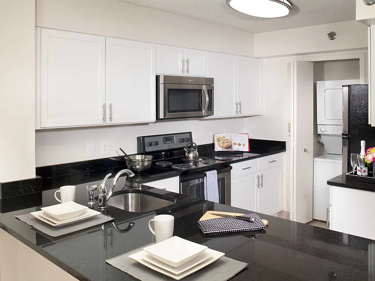 Kitchen with Energy Star Stainless Steel Appliances, Granite Countertops, and Washer and Dryer