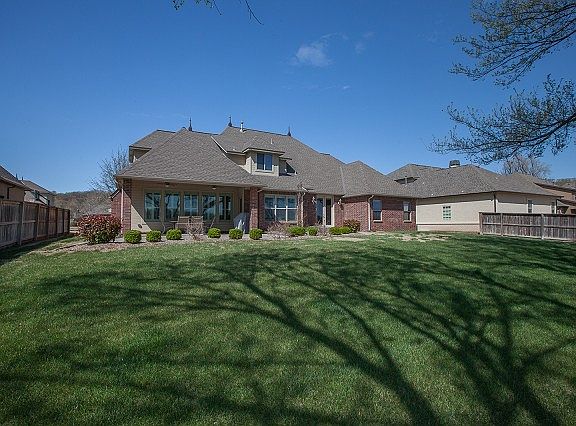 Professionally landscaped with mature trees