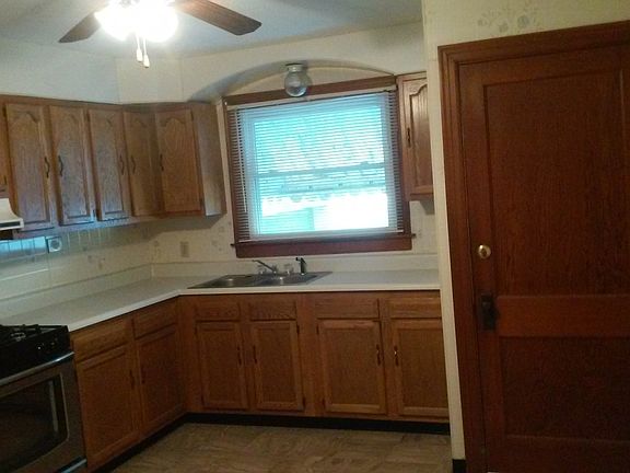 large kitchen with side entrance to driveway.