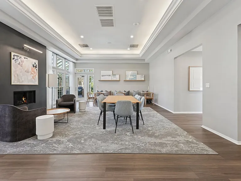 Resident lounge with fireplace and seating