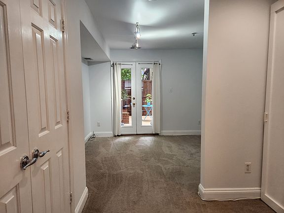 View of bedroom and patio from the living room