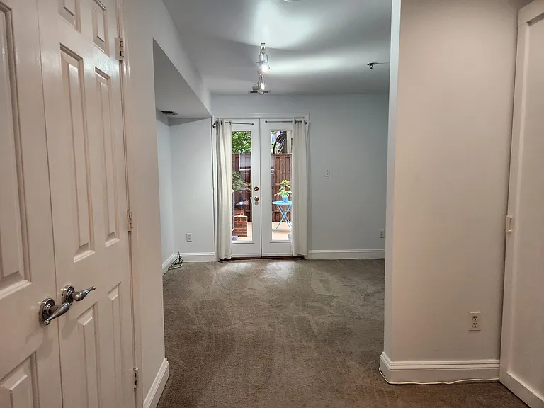 View of bedroom and patio from the living room
