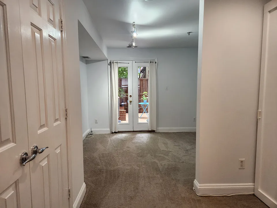 View of bedroom and patio from the living room