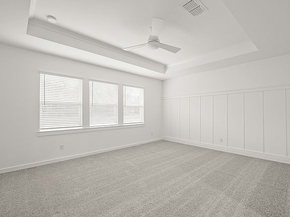 Primary suite with decorative feature wall