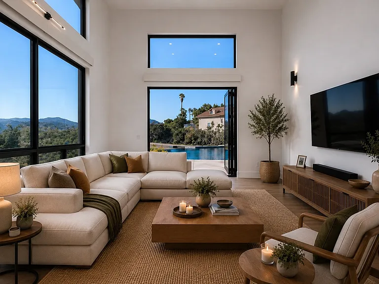 This living area open the kitchen and dining area opens directly with full sliding doors to the pool area. The pool is an amazing water feature to have from your living area even when not the season for use!