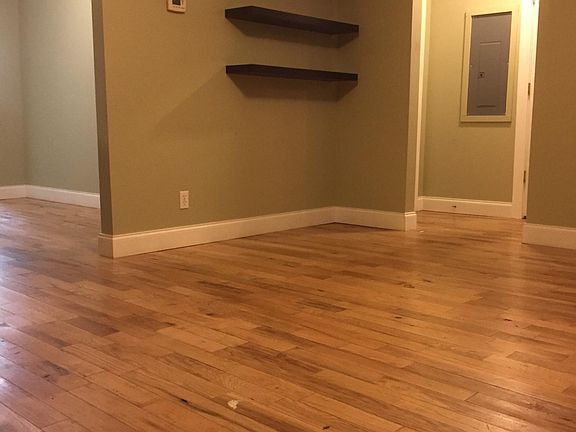Living room: hardwood floors and free float shelving