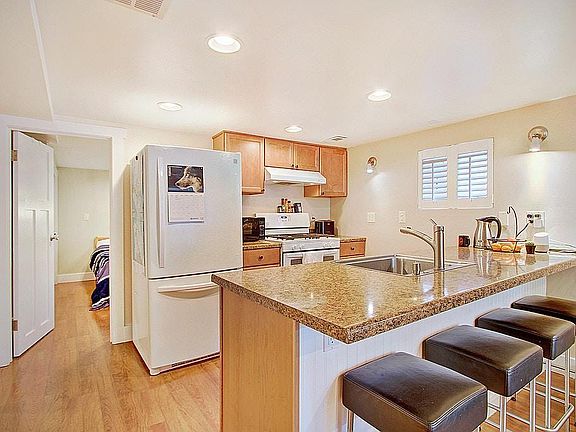 Close up view of kitchen facing south, 2nd bedroom is beyond refrigerator