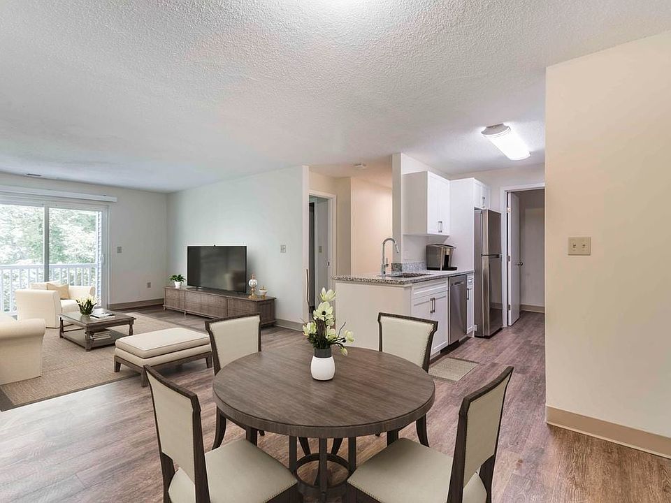 Renovated Package I dining and living room with hard surface flooring