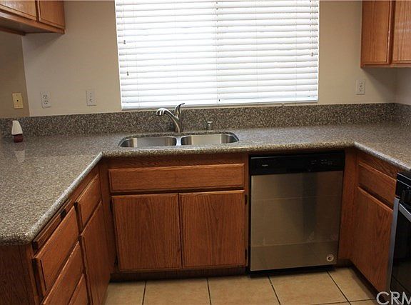 New Granite counters and stainless steel sink with faucet.